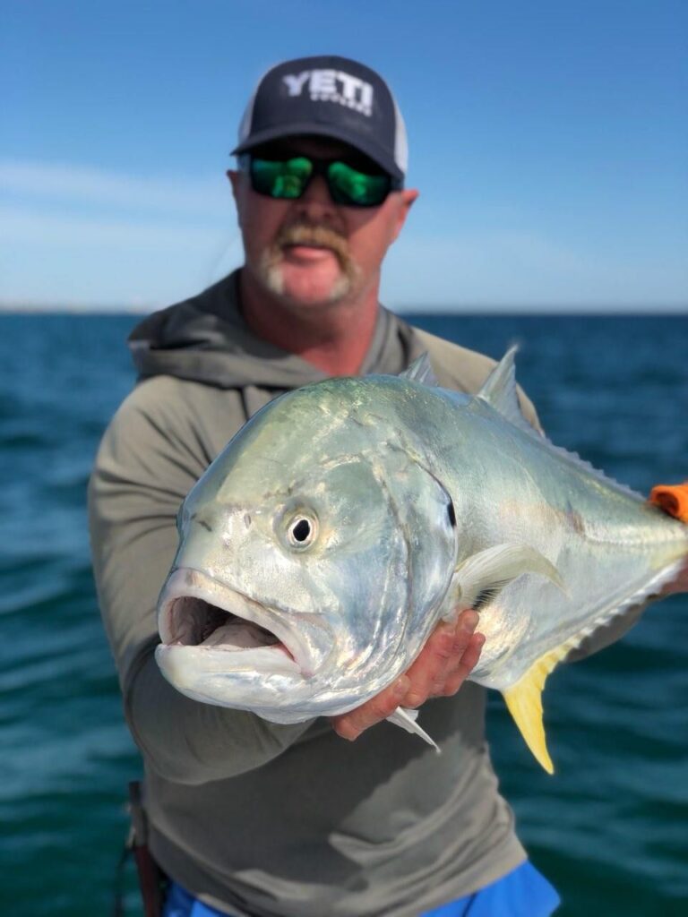 Capt Kevin Lolley Holding a Large Jack Crevalle